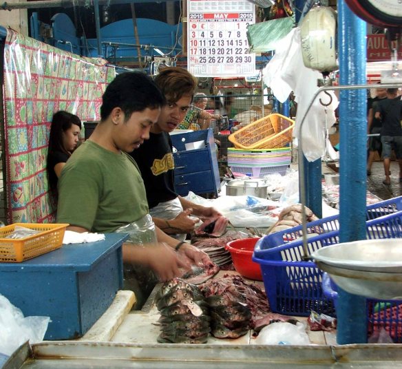 Vendors will clean, scale, and gut fish for buyers